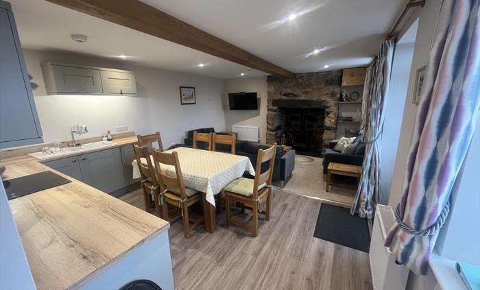 Kitchen diner with log burner in fire place